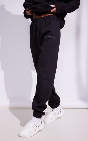 Black Pretty Little Thing Premium Coal Sports Academy Puff Print Oversized Sweatpants | CAPVDUK-45