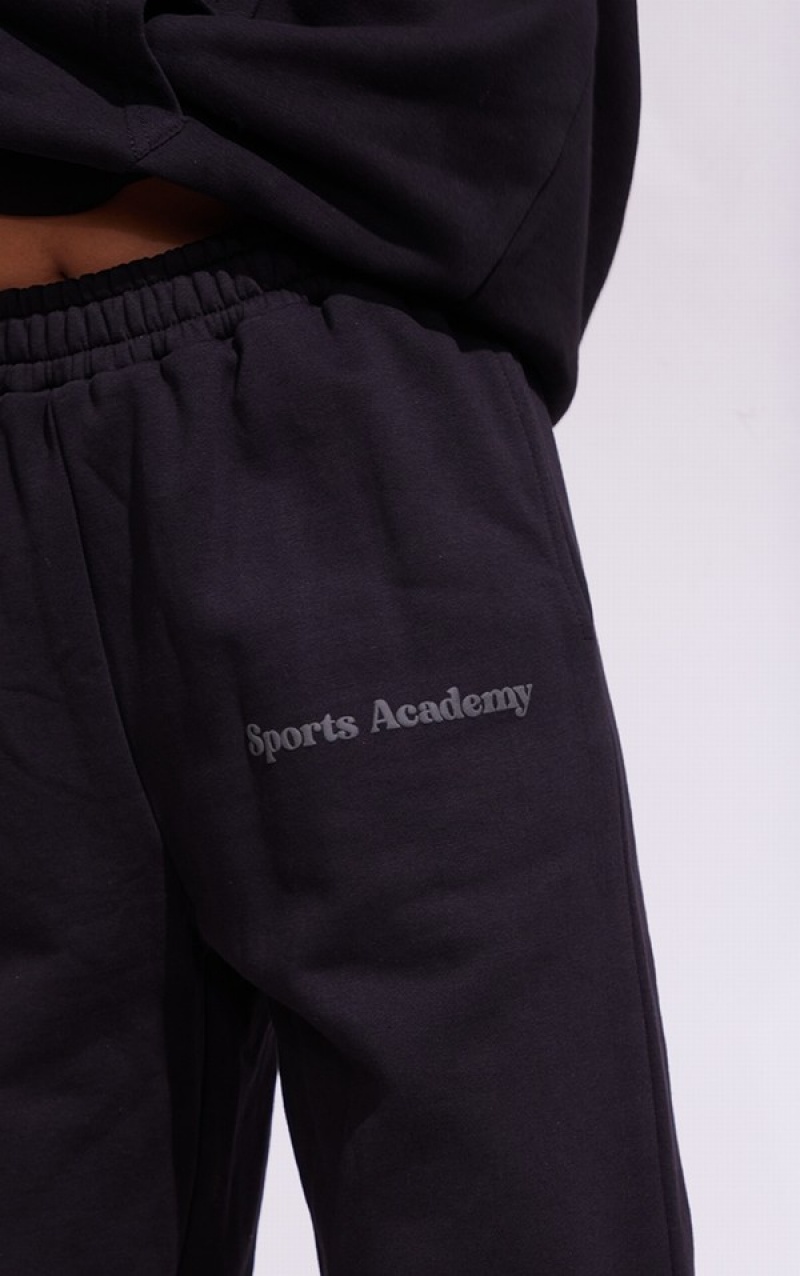 Black Pretty Little Thing Premium Coal Sports Academy Puff Print Oversized Sweatpants | CAPVDUK-45