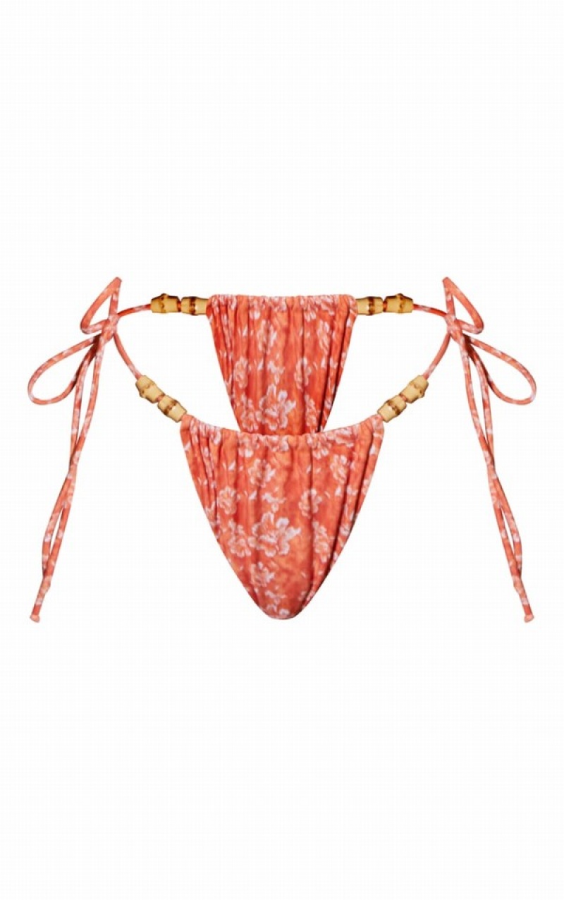 Orange Pretty Little Thing Flower Print Wooden Bead Ruched Tie Side Bikini Bottoms | WJNLSAU-37